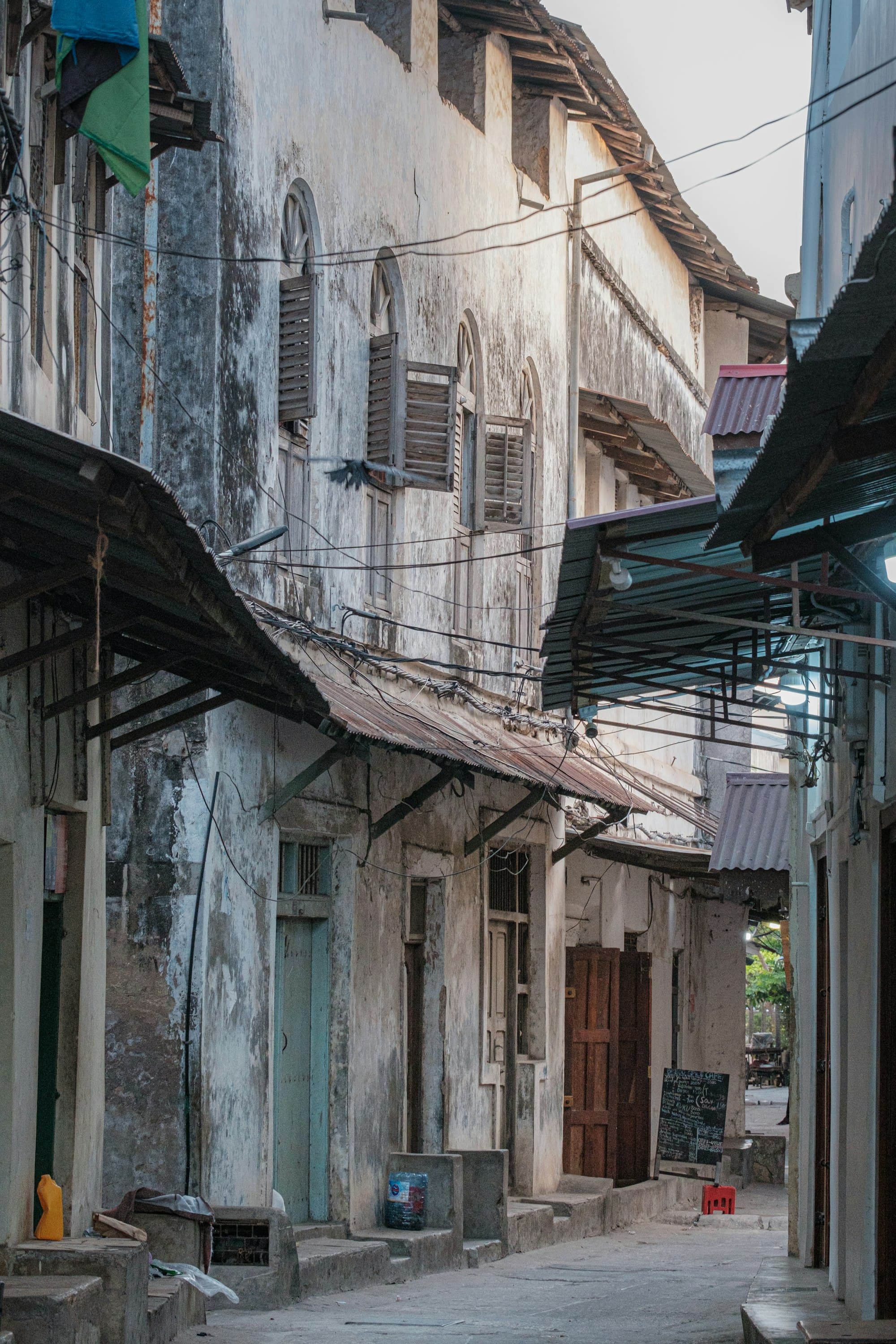 Narrow Stone Town alley with historic buildings