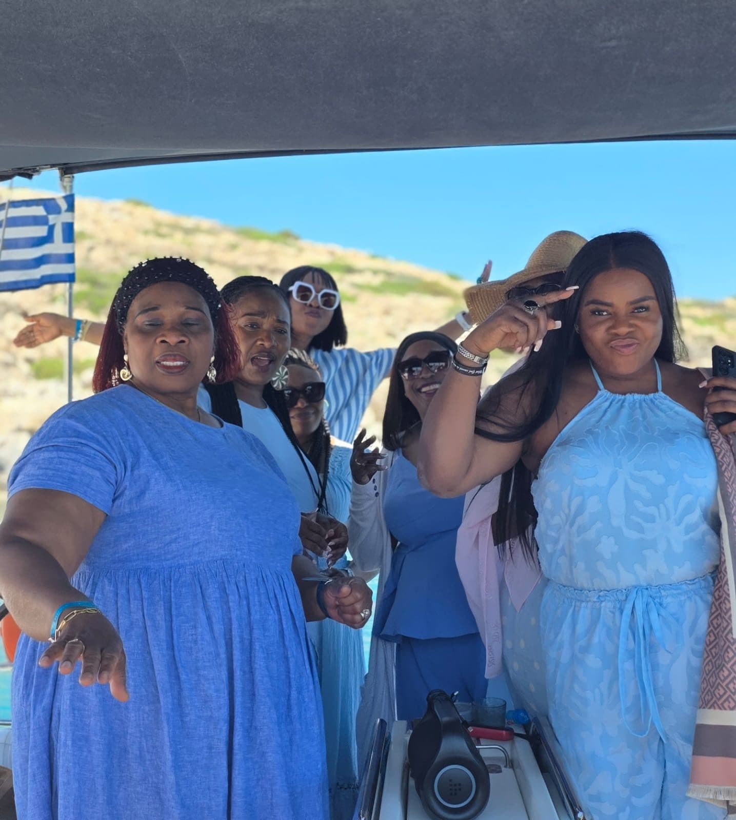 Women in blue on a sailing boat